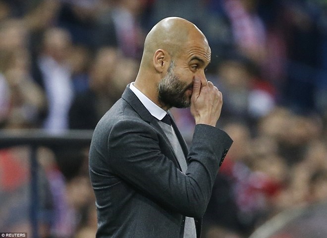 Pep Guardiola ngậm ngùi sau thất bại trước Atletico Madrid. (Nguồn: Reuters)