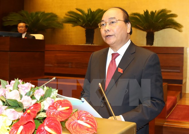 Thủ tướng Nguyễn Xuân Phúc trình bày báo cáo trước Quốc hội sáng 29/7. (Ảnh: Thống Nhất/TTXVN)