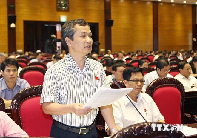 Ðại biểu Quốc hội tỉnh Vĩnh Long Phạm Tất Thắng phát biểu ý kiến thảo luận dự án Luật Căn cước công dân. (Ảnh: /TTXVN)