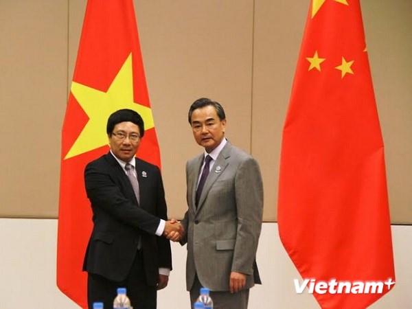 Phó Thủ tướng, Bộ trưởng Ngoại giao Việt Nam Phạm Bình Minh và Bộ trưởng Ngoại giao Trung Quốc Vương Nghị.
