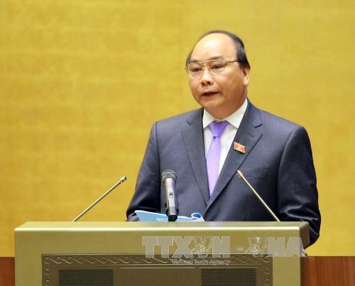  Phó Thủ tướng Chính phủ Nguyễn Xuân Phúc trình bày Báo cáo “ Đánh giá bổ sung kết quả phát triển kinh tế-xã hội năm 2014