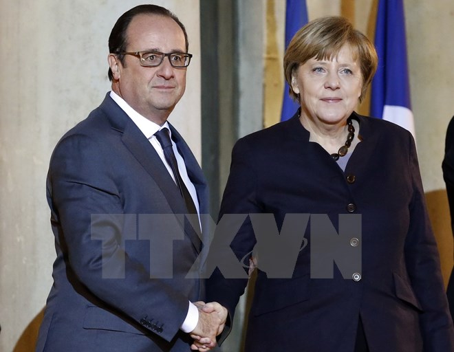 Tổng thống Pháp Francois Hollande (trái) và Thủ tướng Đức Angela Merkel tại cuộc gặp. (Nguồn: AFP/TTXVN)