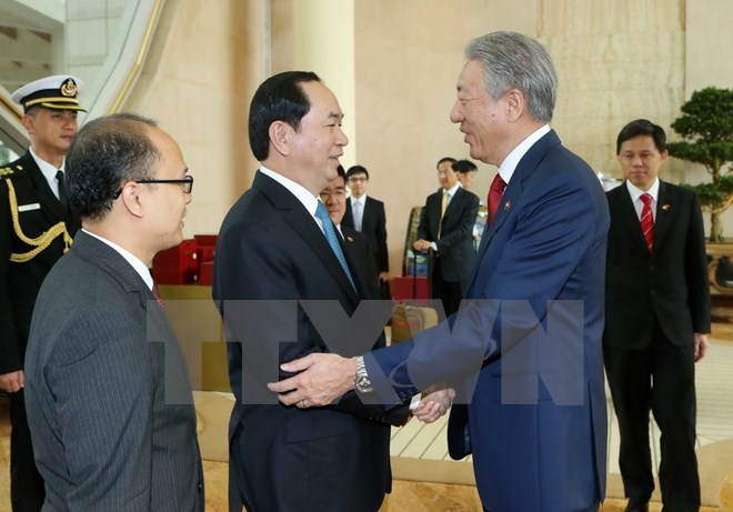 Chủ tịch nước Trần Đại Quang tiếp Phó Thủ tướng Singapore Tiêu Chí Hiền. (Ảnh: Nhan Sáng/TTXVN)