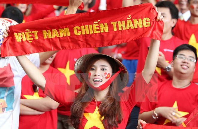 Vietnamese fans support Vietnamese football team at a SEA Games. (Source: VNA)