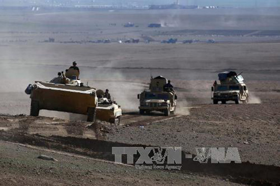 Binh sĩ Chính phủ Iraq trong cuộc giao tranh với phiến quân IS ở làng Badush nhằm giành lại quyền kiểm soát ở Tây Mosul ngày 9/3. Ảnh:AFP/TTXVN