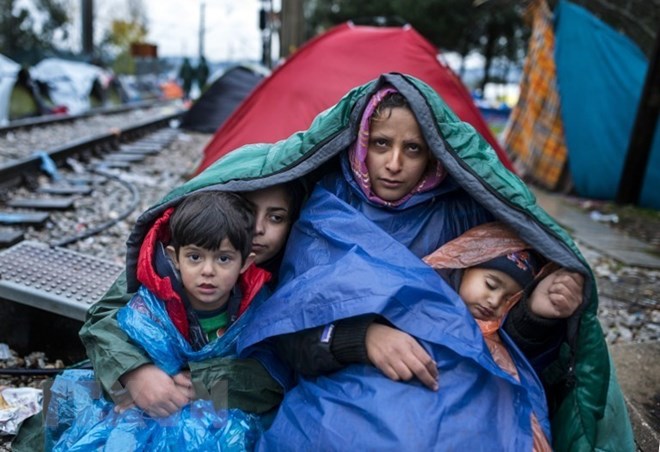 Người di cư tại khu vực biên giới Hy Lạp-Macedonia. (Nguồn: AFP/TTXVN)