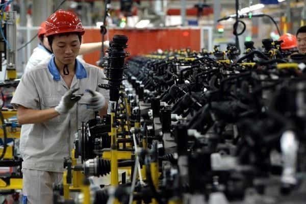 Công nhân làm việc tại một nhà máy ở Trung Quốc. (Nguồn: AFP)