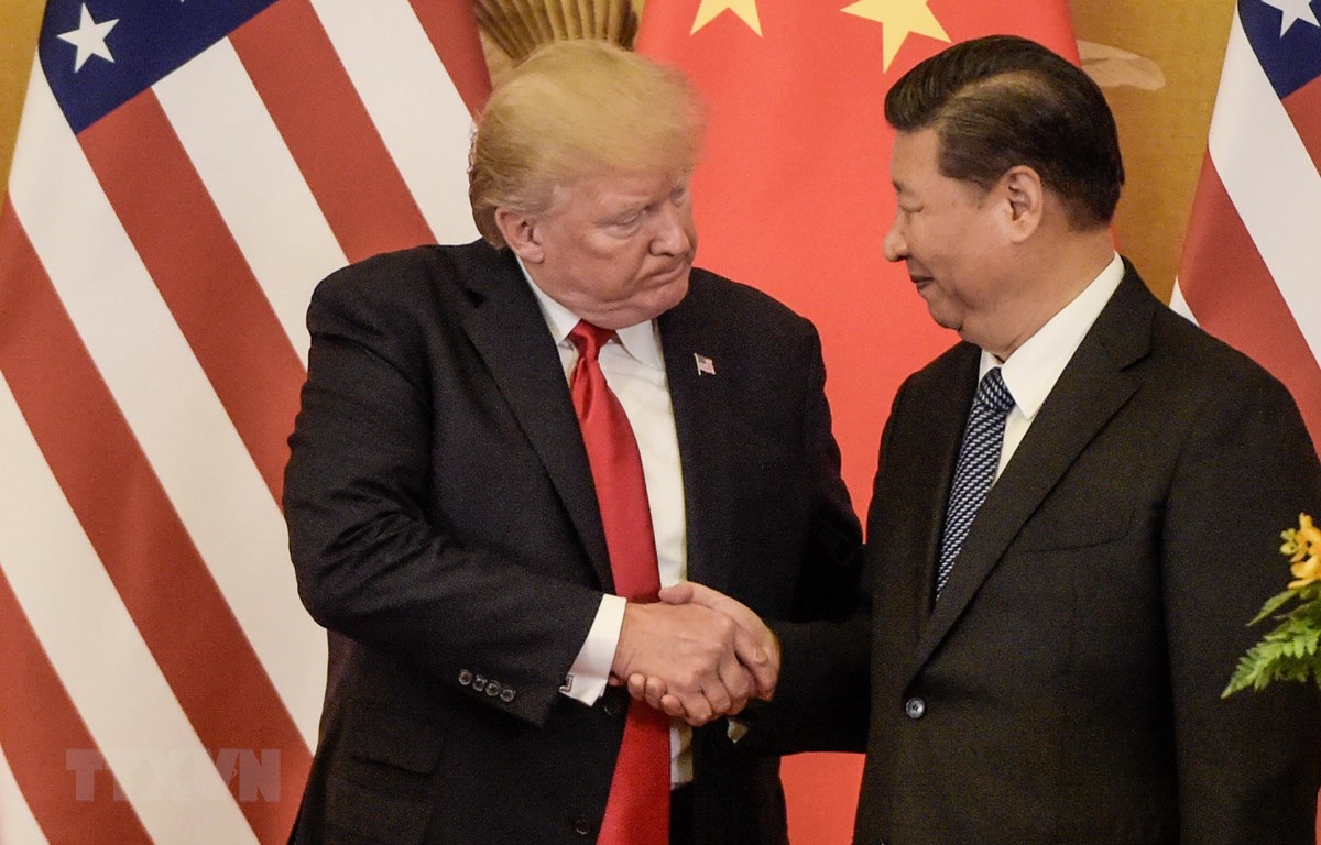  Tổng thống Mỹ Donald Trump (trái) và Chủ tịch Trung Quốc Tập Cận Bình tại cuộc gặp ở Bắc Kinh ngày 9/11/2017. (Ảnh: AFP/TTXVN)