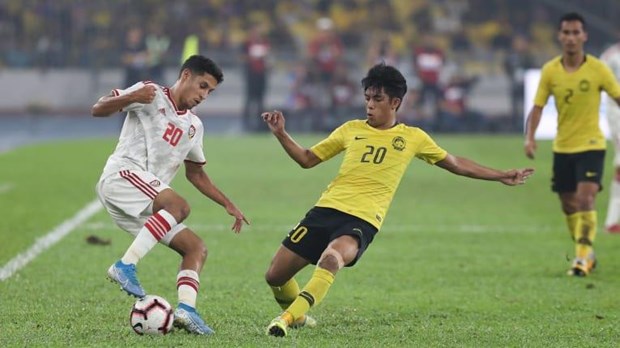 Malaysia (áo vàng) thua ngược UAE trên sân nhà. (Nguồn: AFC)