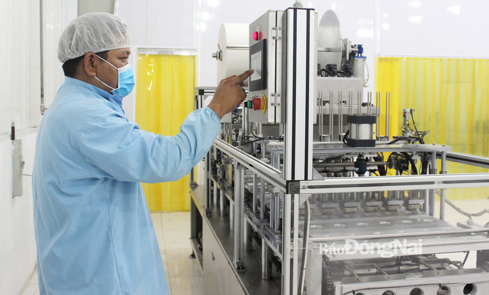 Sản xuất hàng xuất khẩu tại Công ty TNHH Thực phẩm GC ở Khu công nghiệp Hố Nai (H.Trảng Bom). Ảnh: Hương Giang