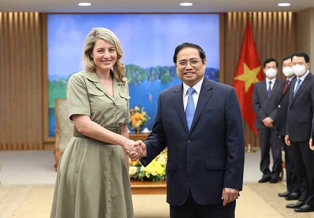 Prime Minister Pham Minh Chinh (R) meets with Canadian Minister of Foreign Affairs Mélanie Joly in Hanoi on April 13.