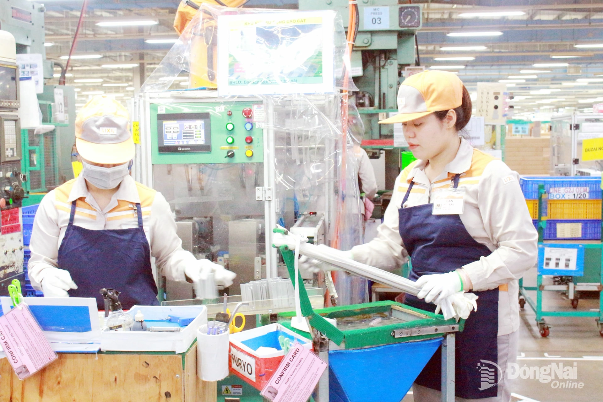 Workers at Lixil Global Manufacturing Vietnam Co., Ltd. in Long Duc Industrial Park, Binh An commune during production hours. Photo: Nguyen Hoa

