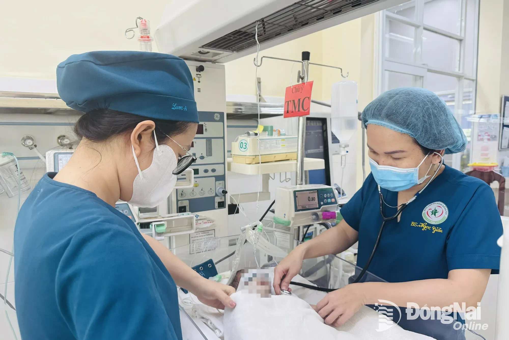 Doctors and nurses at Dong Nai Childrens Hospital care for a severely ill premature baby. Photo: Hanh Dung