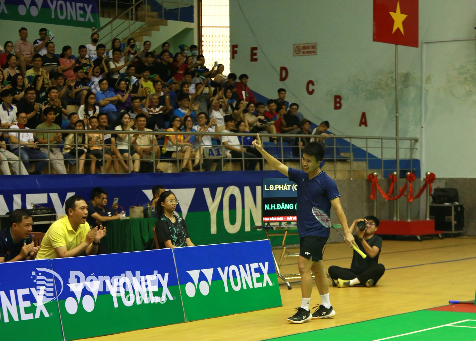 Ho Chi Minh City tennis player Nguyen Hai Dang celebrates winning the mens singles championship. Photo: Huy Anh