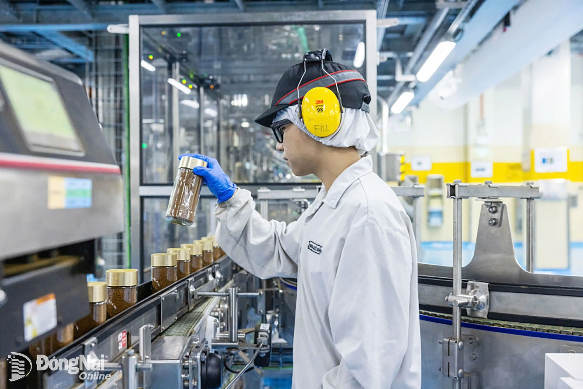Workers inspect products from the packaging line.