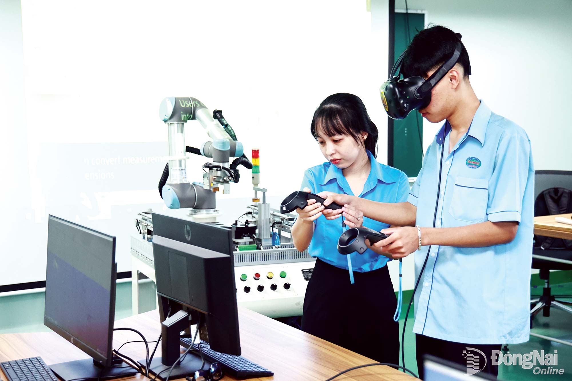 Students at Lilama 2 International Technology College in Long Phuoc Commune practice operating modern robots. Photo: Cong Nghia