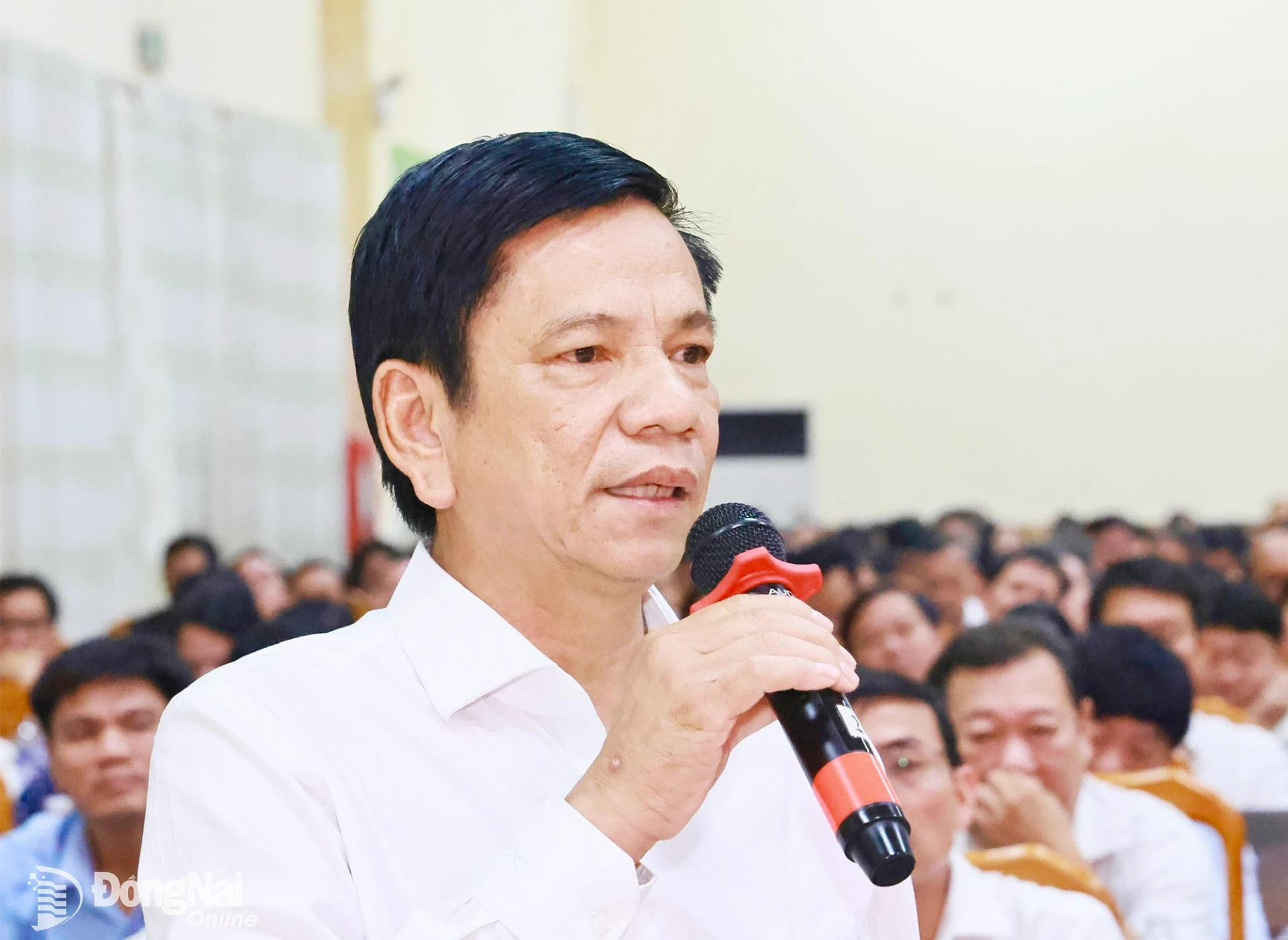 Dr. Nguyen Van Toan, Vice Rector in charge of Dong Nai University, reports on the universitys progress to the CPC’s standing members. Photo: Cong Nghia