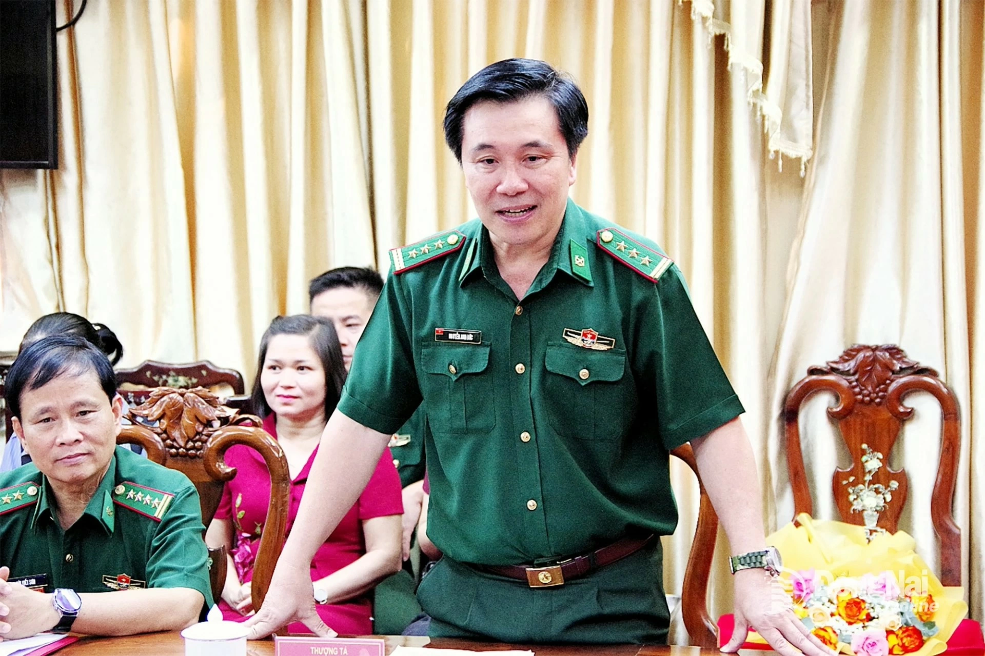 A representative of Dong Nai Provincial Border Guard Command reports on reorganization following the merger. Photo: Xuan Kiet