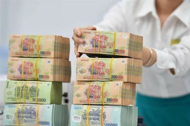 The State Treasury has so far this year continued to expand the coordination of electronic bilateral collection and payment with 20 major commercial banks. (Photo: cafef.vn)