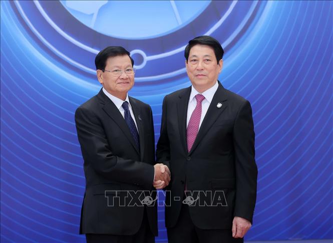 Chủ tịch nước Lương Cường đón Tổng Bí thư, Chủ tịch nước Lào Thongloun Sisoulith dự Lễ mở ký Công ước Hà Nội. Ảnh: TTXVN
