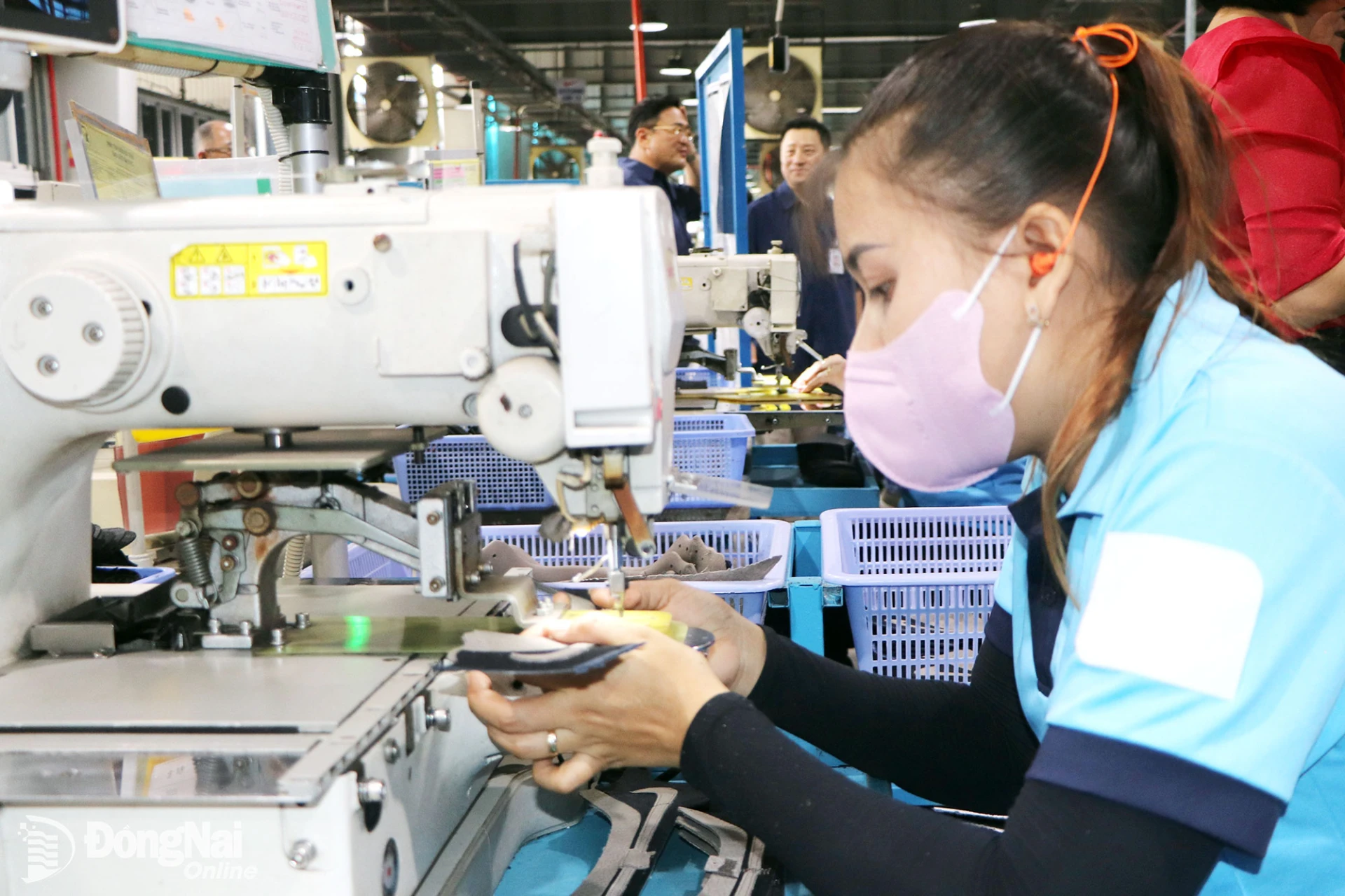 Workers manufacture footwear at Chang Shin Vietnam Co., Ltd. at Thanh Phu IP in Tan Trieu ward.

