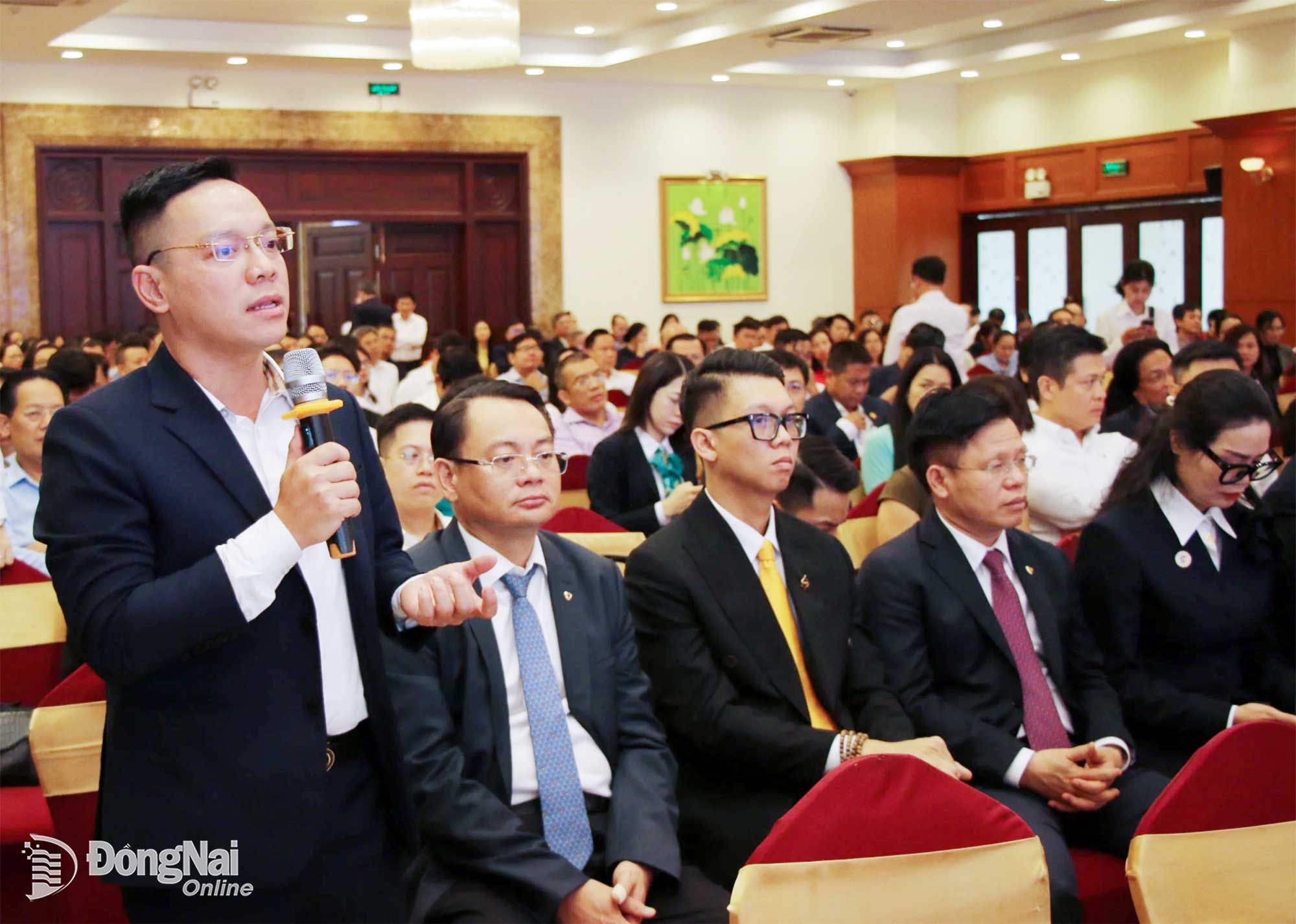 A business representative from Dong Nai speaks at the conference. Photo: Hai Quan

