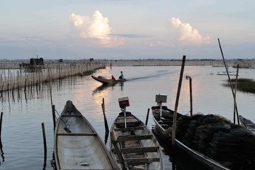 Fishing boats return to dock after a night of fishing.