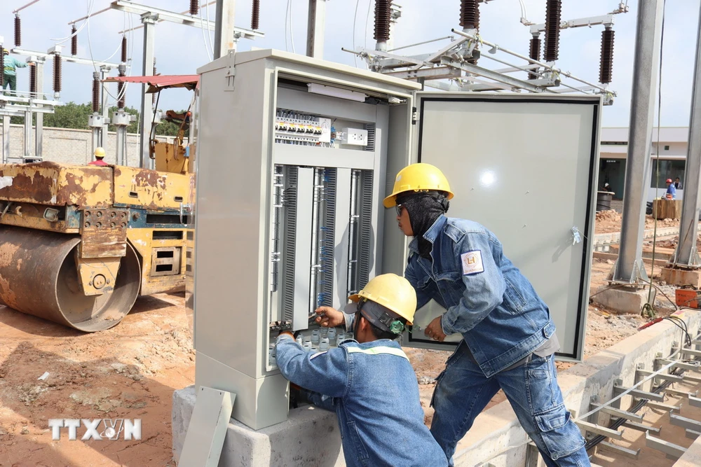 Workers work on the 110kV substation at Long Thanh International Airport - PHOTO: VNA
