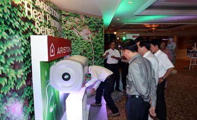 Some visitors have a look at a heating product displayed at the launching event held at the Sheraton Saigon Hotel in HCMC.