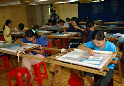 Trainees work at the embroidery workshop of the Phu Van Rehabilitation Centre in HCM City. 