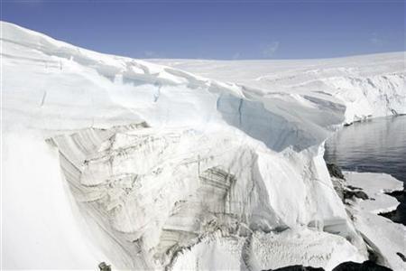 Ice melt shows through at a cliff face at Landsend on the coast of Cape Denison in Antarctica December 14, 2009