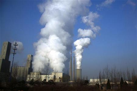 Smoke billows from the chimneys of a coal-burning power station in central Beijing