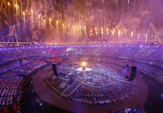 The Olympic cauldron is seen alight as fireworks are set off during the opening ceremony of the London 2012 Olympic Games.