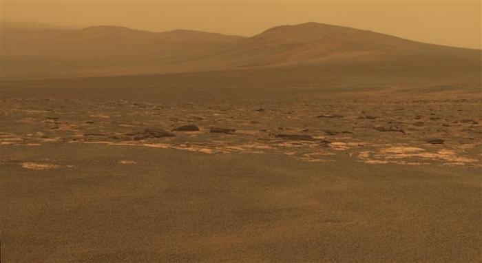 A portion of the west rim of Endeavour crater sweeps southward in this color view from NASA's Mars Exploration Rover Opportunity released in August 2011. 