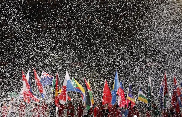 Flag bearers march into the closing ceremony of the London 2012 Olympic Games as confetti rains at the Olympic Stadium August 12, 2012.