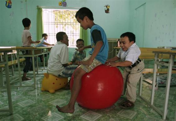 7.	Vietnamese victims of the defoliant Agent Orange play at a social sponsorship centre in Vietnam's Danang city, June 26, 2009.