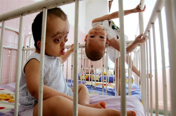 10.	Young Vietnamese disabled victims of Agent Orange play in their cots in a Ho Chi Minh City hospital, bruary 25, 2005.