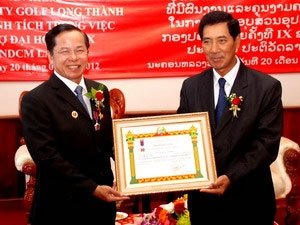 Mr. Bounpon Buttanavong presents Labour Order of Laos to Mr. Kiem