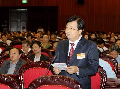 Bộ trưởng Bộ Xây dựng Trịnh Đình Dũng phát biểu ý kiến. Ảnh: TTXVN