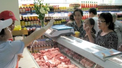 Shoppers at a supermarket in Ho Chi Minh City