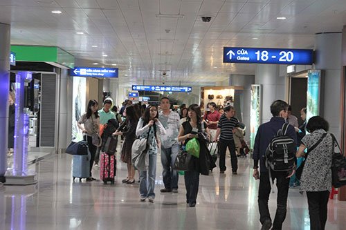 Passengers are seen at Tan Son Nhat International Airport in HCMC. Tan Son Nhat airport is forecast to face overload by 2020.