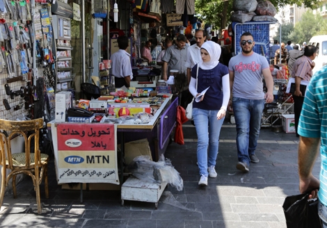 Người dân Syria trên một đường phố ở thủ đô Damascus, Syria ngày 5/9/2013. Ảnh: AFP/TTXVN