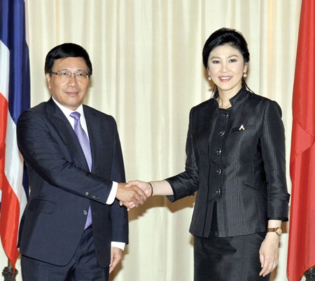 Vietnamese Foreign Minister Pham Binh Minh (left) meets with Thai Prime Minister Yingluck Shinawatra at the Government House in Bangkok, Thailand.