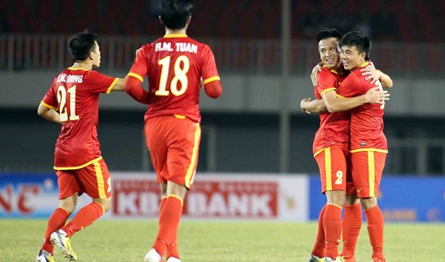 Vietnamese players celebrate a goal during their clash with Laos in the mens football event of the 27th Southeast Asian Games on December 15, 2013.