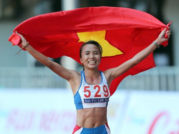 Phạm Thị Bình giành huy chương vàng marathon. (Ảnh: Quang Nhựt/TTXVN)