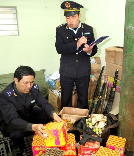 Customs staff check smuggled goods seized in the northern mountainous province of Lang Son.