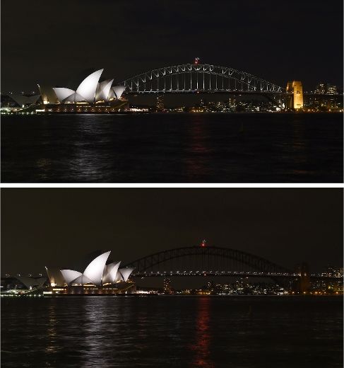 The Sydney Harbour Bridge is seen plunged into darkness for the Earth Hour environmental campaign, among the first landmarks around the world to dim their lights for the event, on March 29, 2014. 
