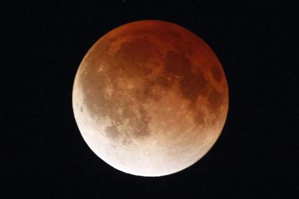 A shadow falls on the moon as seen from Mexico City April 15, 2014. 