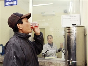 A patient drinking methadone