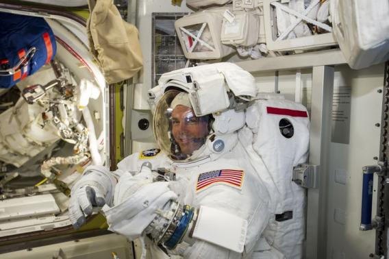 Astronauts venture outside station for spacewalk